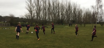 Football on pitch suffolk school kid children